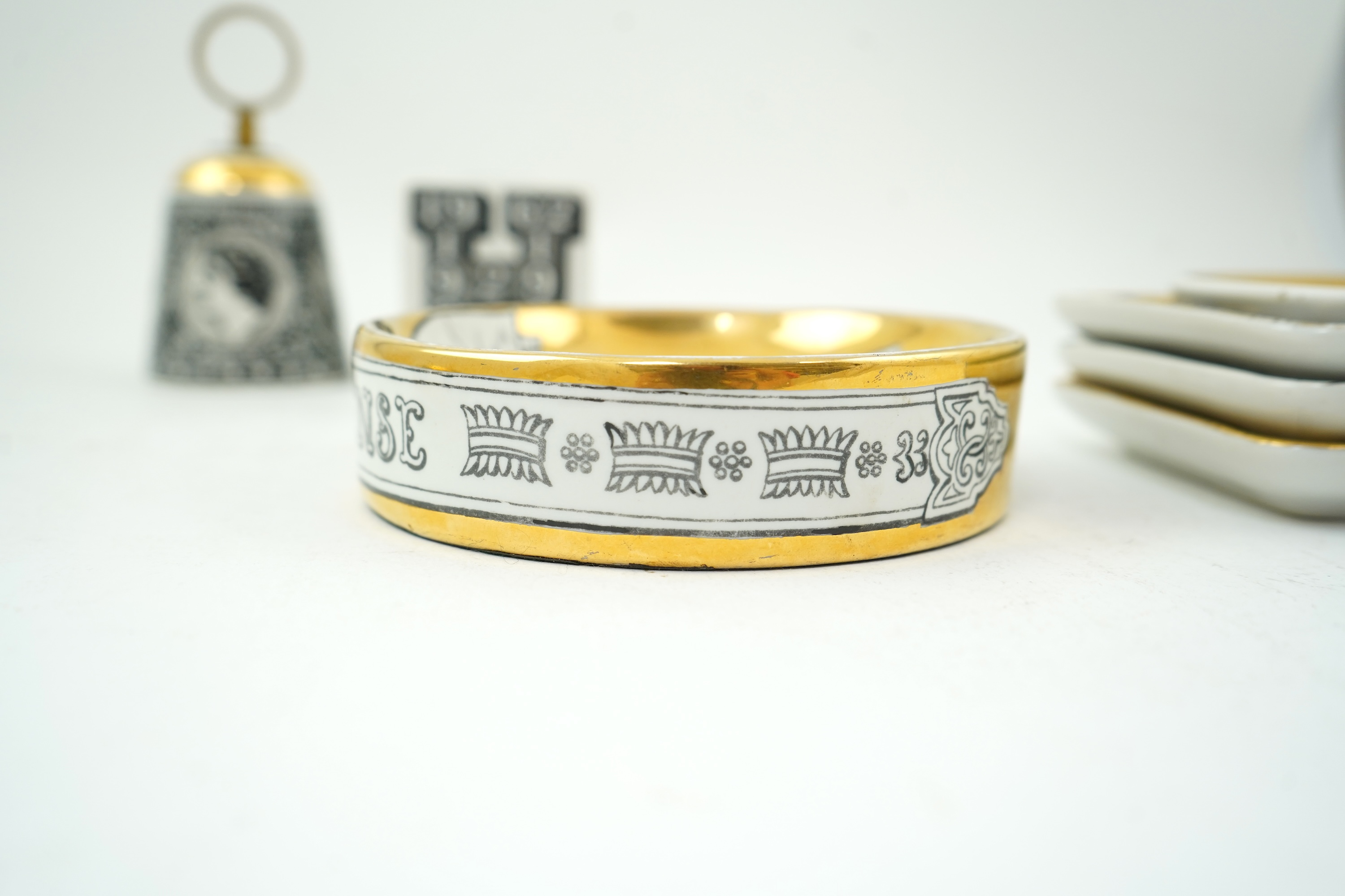 Piero Fornasetti (Italian, 1913-1988): A collection of Fornasetti desk items and dishes
